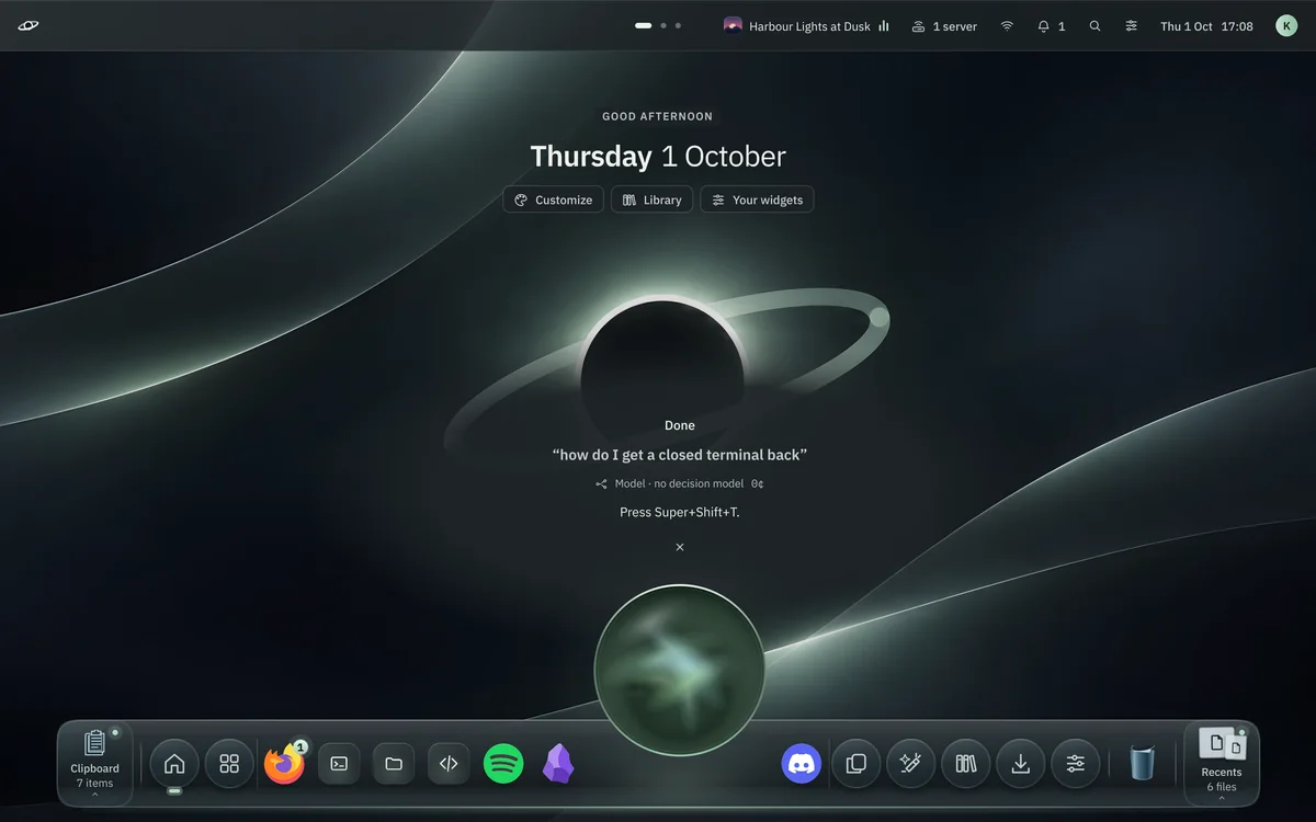 The voice halo over the dock with the answer above it: Done, how do I get a closed terminal back, Press Super+Shift+T.